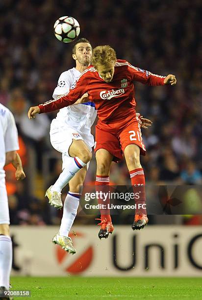 Lucas Levia of Liverpool goes up with Jeremy Toulalan of Lyon during the UEFA Champions League group E match between Lyon and Liverpool at Anfield on...