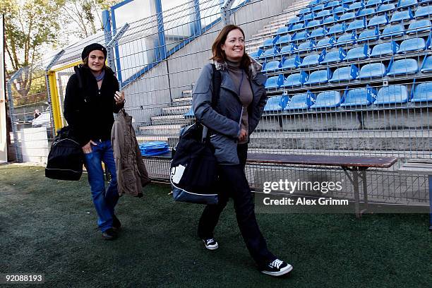 Nadine Angerer and Renate Lingor arrive for the charity football match "Klitschko meets Becker" at the Carl-Benz stadium on October 20, 2009 in...