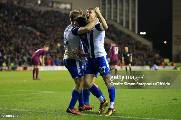 Will Grigg of Wigan celebrates with teammate Ryan Colclough of Wigan after scoring their 1st goal during The Emirates FA Cup Fifth Round match...