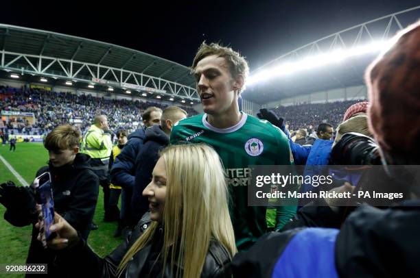 Wigan Athletic's Christian Walton is mobbed by fans after the Emirates FA Cup, Fifth Round match at the DW Stadium, Wigan.