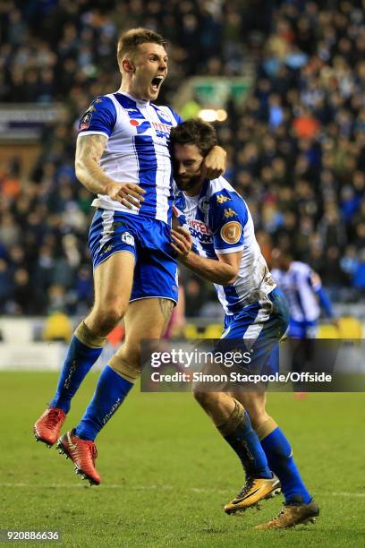 Will Grigg of Wigan celebrates with teammate Max Power of Wigan after scoring their 1st goal during The Emirates FA Cup Fifth Round match between...