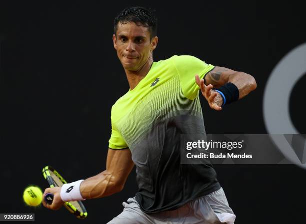 Rogerio Dutra Silva of Brazil returns a shot to Albert Ramos Vinolas of Spain during the ATP Rio Open 2018 at Jockey Club Brasileiro on February 19,...