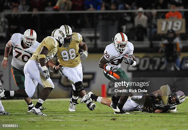Running back Damien Berry of the Miami Hurricanes rushes against the Central Florida Knights at Bright House Networks Stadium on October 17, 2009 in...