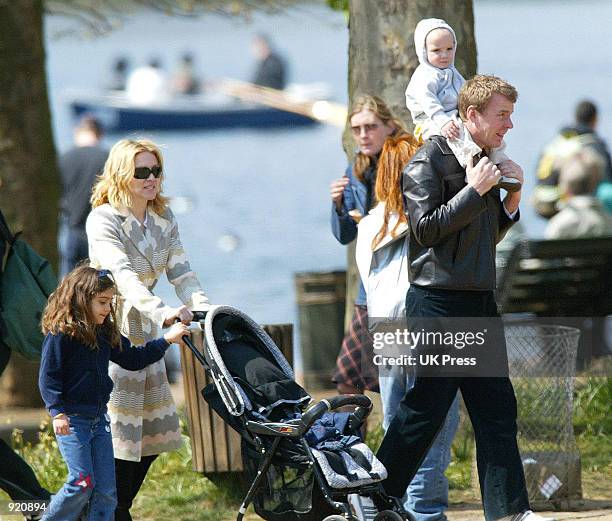 Singer Madonna walks with her husband, producer Guy Ritchie, daughter Lourdes, and son Rocco, during an outing in Hyde Park April 21, 2002 in London,...
