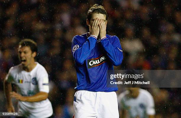 Steven Davis of Rangers reacts after missing a penalty during the UEFA Champions League Group G match between Rangers and Unirea Urziceni at Ibrox...