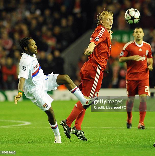 Dirk Kuyt of Liverpool battle with Sidney Govou of Lyon during the UEFA Champions League group E match between Lyon and Liverpool at Anfield on...