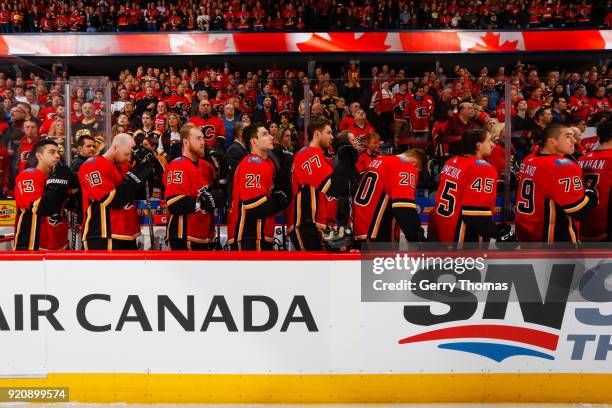 Teammates of the Calgary Flames at the opening in an NHL game on February 19, 2018 at the Scotiabank Saddledome in Calgary, Alberta, Canada.