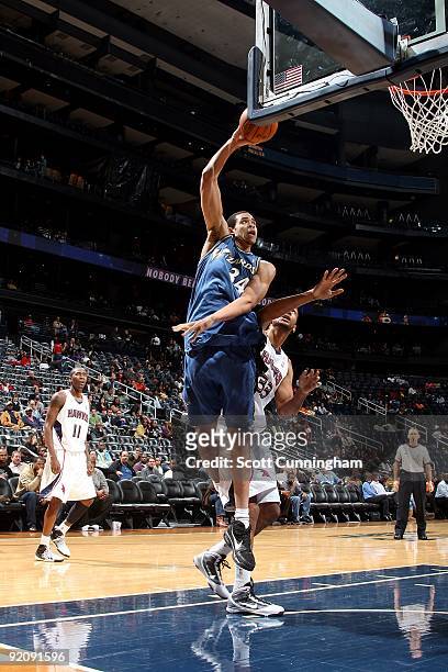 JaVale McGee of the Washington Wizards puts up a shot against the Atlanta Hawks during the preseason game on October 19, 2009 at Philips Arena in...