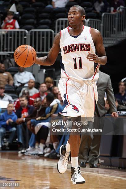 Jamal Crawford of the Atlanta Hawks brings the ball upcourt against the Washington Wizards during the preseason game on October 19, 2009 at Philips...