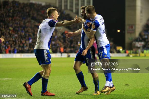 Will Grigg of Wigan celebrates with teammates Max Power of Wigan and Ryan Colclough of Wigan after scoring their 1st goal during The Emirates FA Cup...