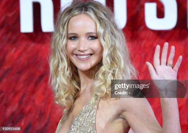 Actress Jennifer Lawrence poses on the red carpet on arrival to attend the European premiere of the film Red Sparrow, in London on February 19, 2018....