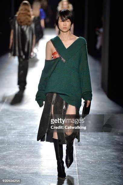 Model walks the runway at the Christopher Kane Autumn Winter 2018 fashion show during London Fashion Week on February 19, 2018 in London, United...
