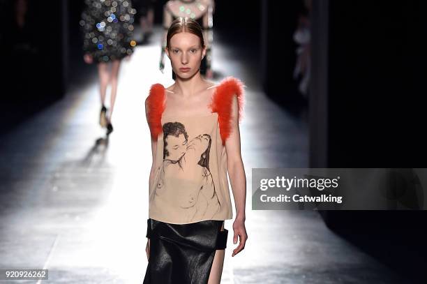 Model walks the runway at the Christopher Kane Autumn Winter 2018 fashion show during London Fashion Week on February 19, 2018 in London, United...