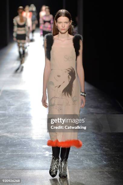 Model walks the runway at the Christopher Kane Autumn Winter 2018 fashion show during London Fashion Week on February 19, 2018 in London, United...