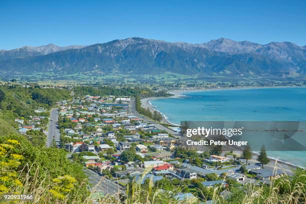 view of the city of kaikoura, kaikoura, canterbury, south island, new zealand - kaikoura stock pictures, royalty-free photos & images