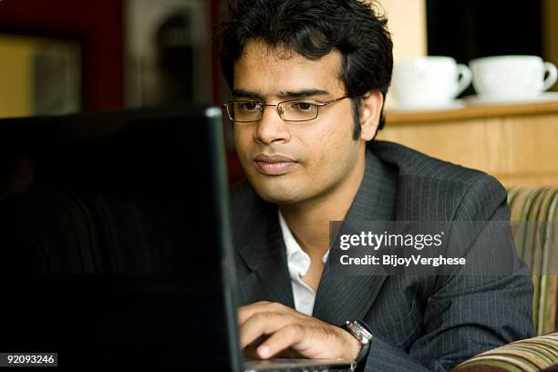 smart indian business man working on computer - intelligence agency stock pictures, royalty-free photos & images