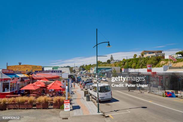 main city retail area of kaikoura, canterbury, south island, new zealand - kaikoura stock pictures, royalty-free photos & images