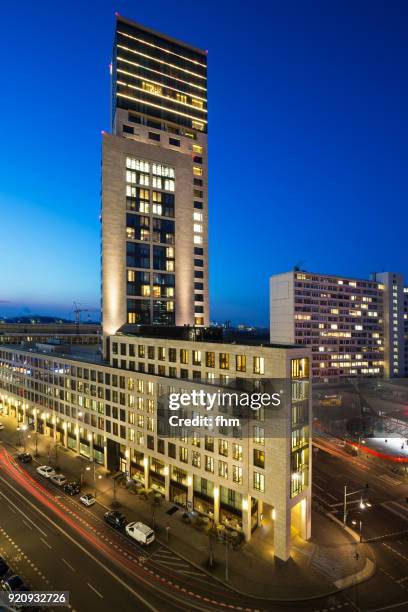 modern skyscraper in the city of berlin at blue hour (berlin, germany) - berlin mitte stock-fotos und bilder