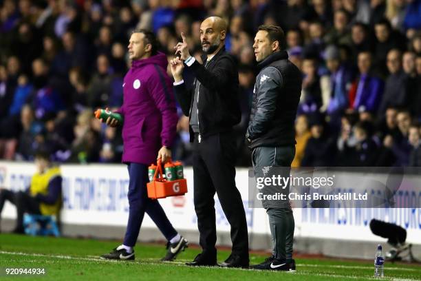 Manchester City manager Josep Guardiola gestures during the Emirates FA Cup Fifth Round match between Wigan Athletic and Manchester City at DW...