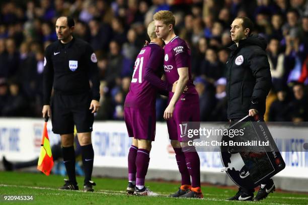 Kevin De Bruyne of Manchester City replaces teammate David Silva as a substitute during the Emirates FA Cup Fifth Round match between Wigan Athletic...