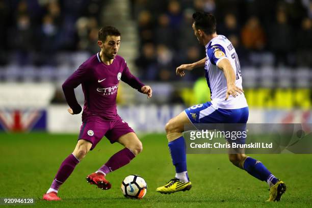Bernardo Silva of Manchester City and Gary Roberts of Wigan Athletic in action during the Emirates FA Cup Fifth Round match between Wigan Athletic...