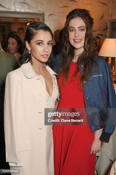 Naomi Scott and Millie Brady attend the LOVE x Miu Miu Women's Tales dinner hosted by Katie Grand and Elle Fanning at Loulou's on February 19, 2018...