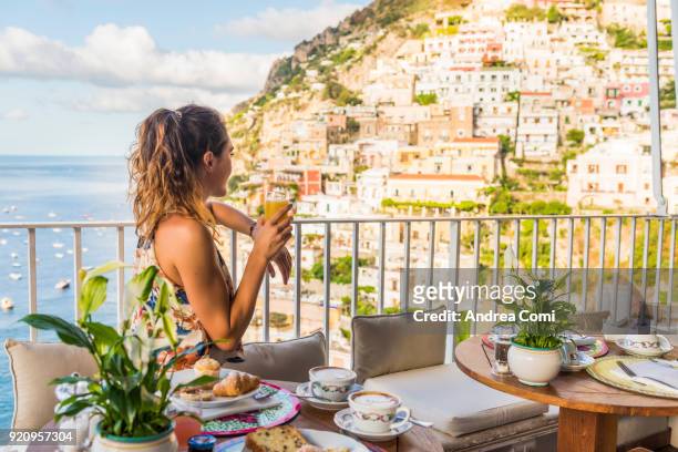 young woman having breakfast in positano - mediterranean stockfoto's en -beelden