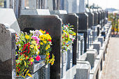 Cemetery tombstones and flowers