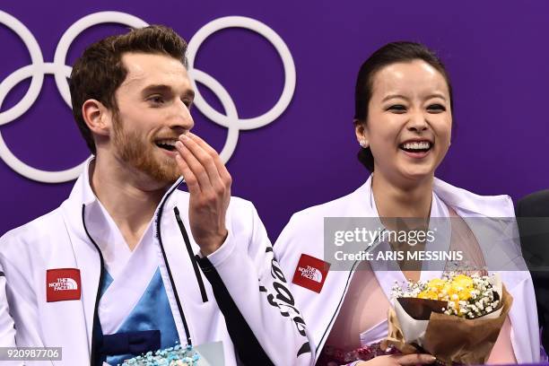 South Korea's Yura Min and South Korea's Alexander Gamelin react after competing in the ice dance free dance of the figure skating event during the...