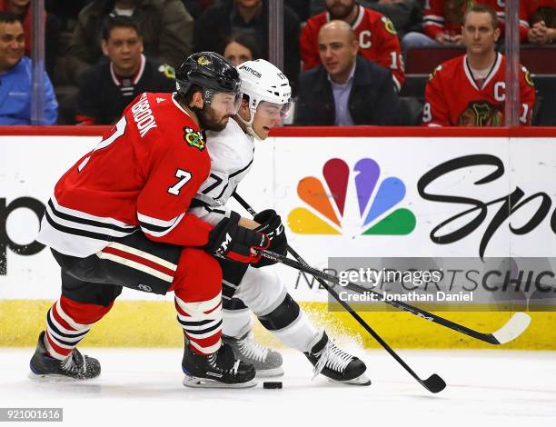 Brent Seabrook of the Chicago Blackhawks pressures Torrey Mitchell of the Los Angeles Kings at the United Center on February 19, 2018 in Chicago,...