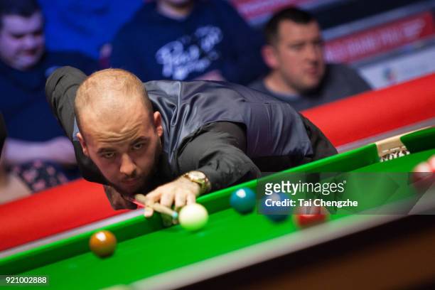 Luca Brecel of Belgium plays a shot during his first round match against Michael Georgiou of Cyprus on day one of 2018 Ladbrokes World Grand Prix at...