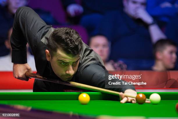 Michael Georgiou of Cyprus plays a shot during his first round match against Luca Brecel of Belgium on day one of 2018 Ladbrokes World Grand Prix at...