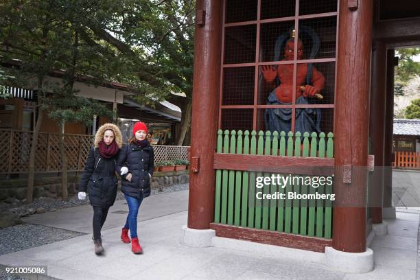 Tourists walk at the Kotokuin temple in Kamakura, Kanagawa, Japan, on Monday, Feb. 19, 2018. The Japan National Tourism Organization's monthly...