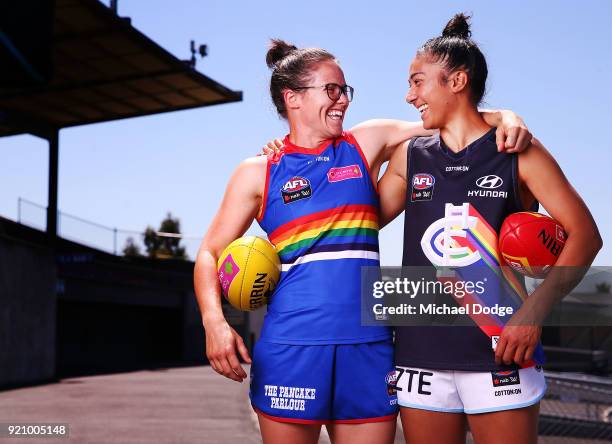 Carlton AFLW forward Darcy Vescio and Bulldog Emma Kearney pose in front of the E.J Whittem Stand with their Pride guernseys for Friday nightÕs game...