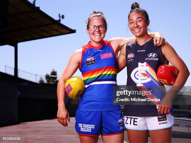 Carlton AFLW forward Darcy Vescio and Bulldog Emma Kearney pose in front of the E.J Whittem Stand with their Pride guernseys for Friday nightÕs game...