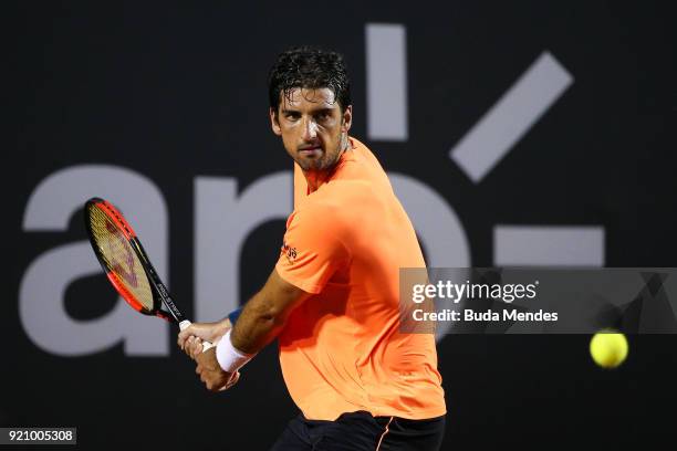 Thomaz Bellucci of Brazil returns a shot to Fabio Fognini of Italy during the ATP Rio Open 2018 at Jockey Club Brasileiro on February 19, 2018 in Rio...