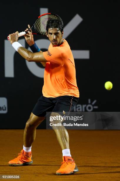 Thomaz Bellucci of Brazil returns a shot to Fabio Fognini of Italy during the ATP Rio Open 2018 at Jockey Club Brasileiro on February 19, 2018 in Rio...