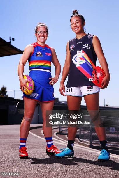 Carlton AFLW forward Darcy Vescio and Bulldog Emma Kearney pose in front of the E.J Whittem Stand with their Pride guernseys for Friday nightÕs game...