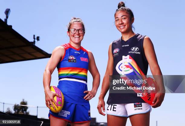 Carlton AFLW forward Darcy Vescio and Bulldog Emma Kearney pose in front of the E.J Whittem Stand with their Pride guernseys for Friday nightÕs game...