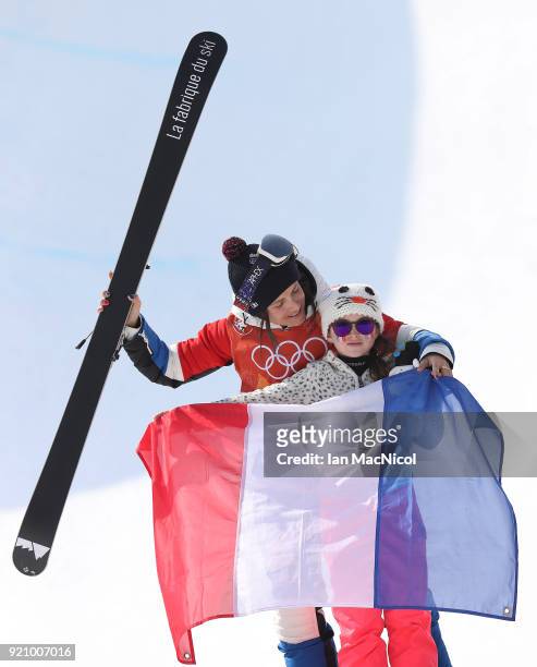 Marie Martinod of France and her daughter Melirose,stand on the podium after the Women's Halfpipe final at Phoenix Snow Park on February 20, 2018 in...