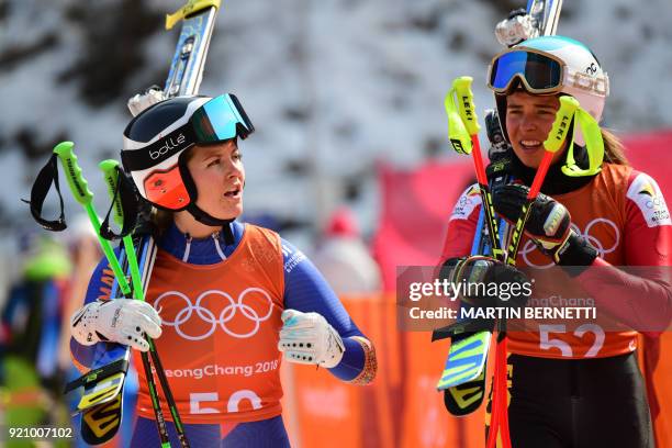 Romania's Ania Monica Caill and Belgium's Kim Vanreusel leave after the 3rd training of the Alpine Skiing Women's Downhill at the Jeongseon Alpine...