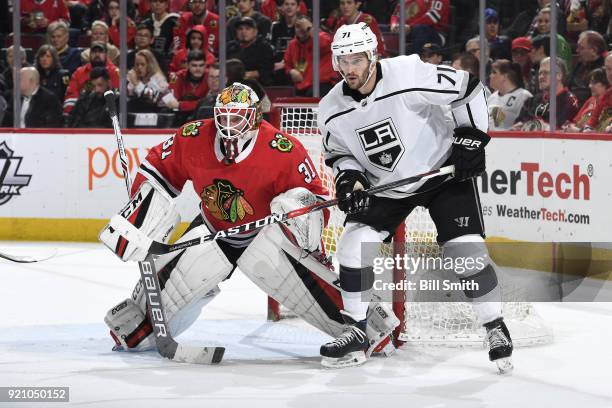 Torrey Mitchell of the Los Angeles Kings waits in position next to goalie Anton Forsberg of the Chicago Blackhawks in the second period at the United...
