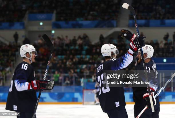 James Wisniewski of the United States celebrates after with his teammates after scoring a goal against Jan Laco of Slovakia in the second period...