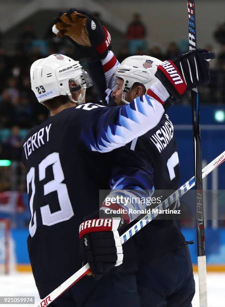 James Wisniewski of the United States celebrates after with his teammate Troy Terry after scoring a goal against Jan Laco of Slovakia in the second...