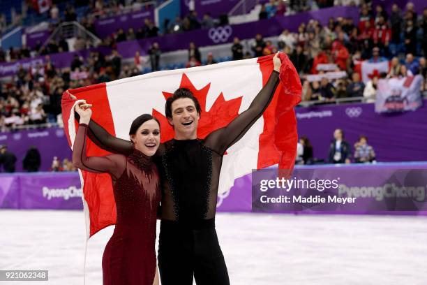 Gold medal winners Tessa Virtue and Scott Moir of Canada celebrate during the victory ceremony for the Figure Skating Ice Dance Free Dance on day...