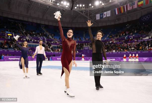 Gold medal winners Tessa Virtue and Scott Moir of Canada celebrate during the victory ceremony for the Figure Skating Ice Dance Free Dance on day...