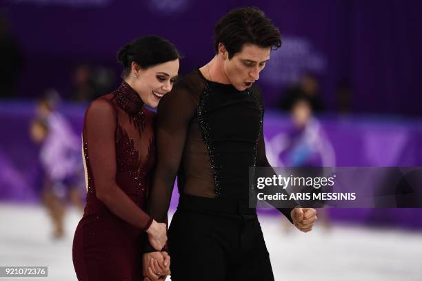 Canada's Tessa Virtue and Canada's Scott Moir react after competing in the ice dance free dance of the figure skating event during the Pyeongchang...