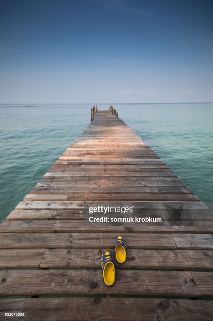 Wooden walk path with blue sea in summer