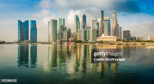singapore marina bay crowded skyscraper skyline panorama downtown financial district - merlion park stock pictures, royalty-free photos & images
