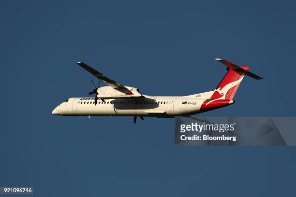 Bombardier Inc. Q400 turboprop aircraft operated by Qantas Airways Ltd.'s regional airline QantasLink takes off from Sydney Airport in Sydney,...